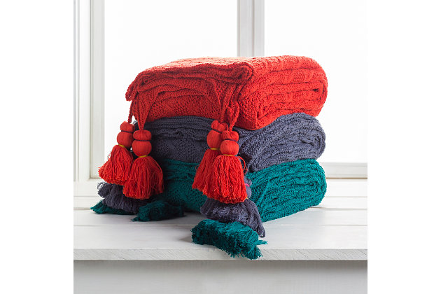 Fringe benefit. Sporting fringed details for a fun, flirty feel, this easy-elegant throw blanket has so much appeal. What a timeless choice for incorporating texture and tone and making a space more alluring.Made of cotton | Tassel details | Spot clean recommended, line dry | Imported