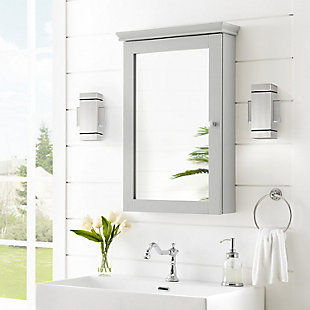 Sure to be a bathroom essential, the lydia mirrored wall cabinet is a stylish solution to the classic medicine cabinet. The large glass mirror is complemented by a border of genuine wood, capped by beautiful flared molding. Inside you will find three adjustable shelves and plenty of storage space for toiletries. The lydia mirrored wall cabinet mounts flush against the wall, maximizing space without sacrificing storage.Genuine metal hardware in a brushed nickel finish | Three adjustable and removable shelves | Mounts flush against the wall | Classic mirrored door