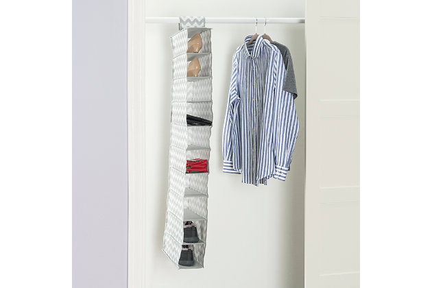 Store and organize your household essentials in this hanging organizer. Made from heavy duty breathable non-woven material, it features 10 shelves in a vertical orientation to provide ample space for clothes and more. Hangs on most standard closet rods. Velcro strap to secure the organizer. Collapsible when not in use.Made of non-woven material | 10 spacious shelves to neatly organize all your household essentials | Chevron finish adds a classic chic flair to your closet | Velcro strap to secure the organizer