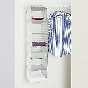 Store and organize your household essentials in this hanging organizer. Made from heavy duty breathable non-woven material, it features 6 shelves in a vertical orientation to provide ample space for clothes and more. Hangs on most standard closet rods. Velcro strap to secure the organizer. Collapsible when not in use.Made of non-woven material | 6 spacious shelves to neatly organize all your household essentials | Chevron finish adds a classic chic flair to your closet | Velcro strap to secure the organizer