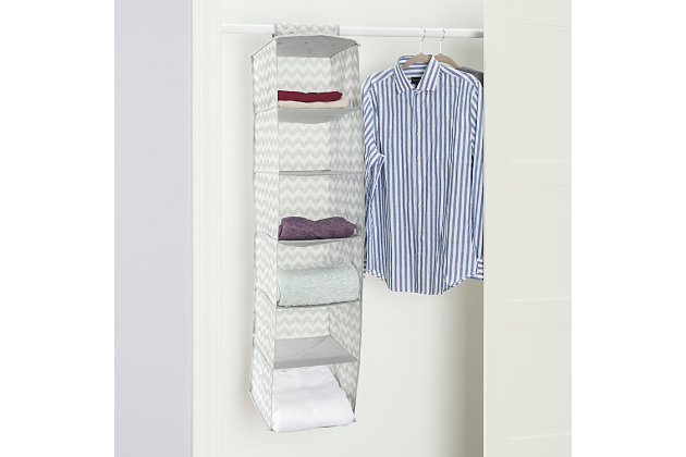 Store and organize your household essentials in this hanging organizer. Made from heavy duty breathable non-woven material, it features 6 shelves in a vertical orientation to provide ample space for clothes and more. Hangs on most standard closet rods. Velcro strap to secure the organizer. Collapsible when not in use.Made of non-woven material | 6 spacious shelves to neatly organize all your household essentials | Chevron finish adds a classic chic flair to your closet | Velcro strap to secure the organizer