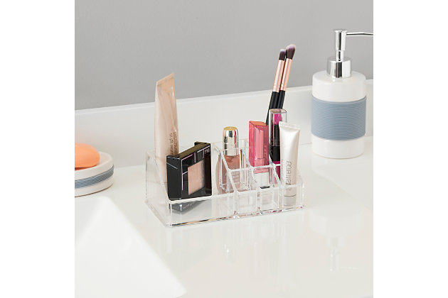 Store and organize your make-up and other essentials in this cosmetic box. Made from heavy duty clear plastic. 9 compartments to hold a lot of items. Perfect for make-up & jewelry. Compact design lets it fit in tight spaces on a bathroom counter.Made from heavy duty clear plastic | 9 compartments to hold a lot of items | Ideal for storing small cosmetic products, keepsakes, and accessories | Compact design lets it fit in tight spaces on a bathroom counter