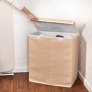 Tall, lined and attractive—you’ve got a type when it comes to your taste in laundry bins. That’s why you couldn’t take your eyes off of this Large Dual Laundry Hamper with Lid when it walked into the room. Its sleek resin exterior oozes sophistication, making it a stylish hamper for your bedroom or any room you see fit. You can even use it as a makeshift storage bin to stow away bedding, throw pillows or extra decor—then stow it away when it’s not in use. And if you’re looking to put its sturdy stature to work as an actual laundry sorter, its breathable, two-bin interior will help you breathe easier on chore day, too.Two compartment laundry hamper with lid | Durable wicker exterior; breathable canvas interior | Collapsible hamper folds flat for easy storage