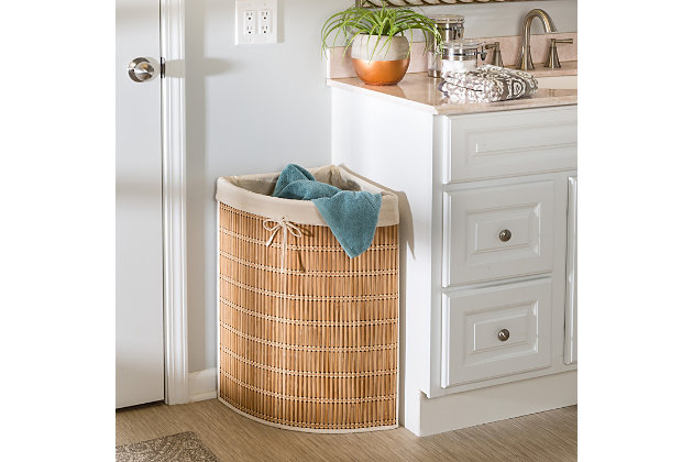 It’s never ending. The piles keep growing while your will to complete the laundry keeps shrinking. Not only that, but the overflow has found its way into the middle of the room because your clunky hamper just can’t find a home that suits you. This corner hamper with its own cotton canvas laundry bag will do the trick as it politely backs its way into any corner, while still having the capacity to hold several loads of laundry. And its subtle style lends itself to any room you might need it in.Hamper fits snugly into any corner in any room | Moisture-resistant material | Machine-washable cotton canvas liner