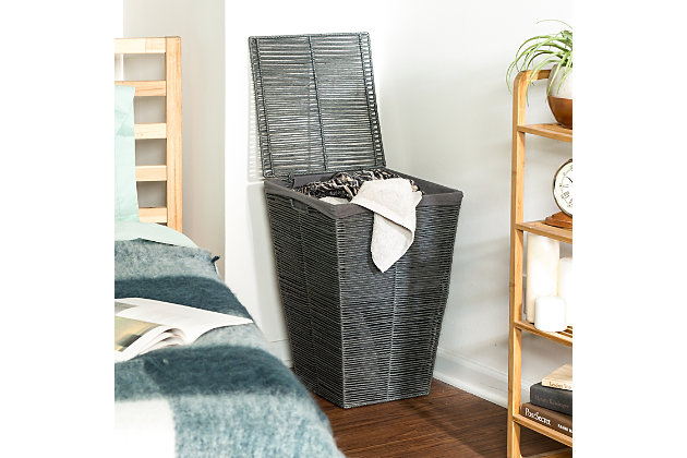 You’re all about giving out laundry tips these days—skip the fabric softener, make him wash his own clothes and purchase this Rolled Paper Rope Hamper immediately. You know that this Coastal Collection beauty delivers on both design and durability. Its square shape fits right into your bedroom decor, pairing perfectly with the geometric-patterned area rug and your cool cat palm. You enjoy piling clothes inside the roomy interior of this big hamper and concealing them with a flip of the lid. It’s lined with cotton too, so you never have to worry about unsightly odors. And while no pro tip can ever wipe out the malaise of chore day, at least this cool hamper can make it look good.Decorative hamper with rolled paper rope exterior | Cool grey finish | Made with natural fibers and a steel frame