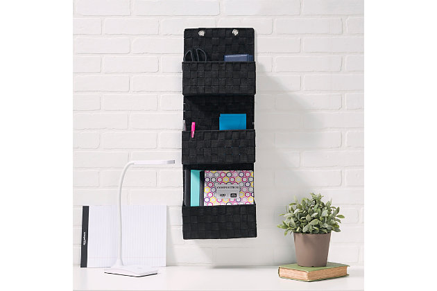 A durable and stylish storage solution, this organizer is supported with a durable epoxy coated frame to keep its shape and includes an intricate woven fabric for dynamic texture. Equipped with two ¾ inch steel grommets, it easily hangs on the wall to conserve space. Use it in the office to make sense out of those mounds of paperwork and keep offices supplies in their proper place. Store it in the living room to keep track of your DVD collection. Or keep one in the bedroom to corral odds and ends.Made of non-woven fabric and steel | Black | 3 tiers | 3 baskets | Woven baskets provide ample storage space for mail, office supplies, shoes, magazines and other odds and ends | Hanging hardware not included