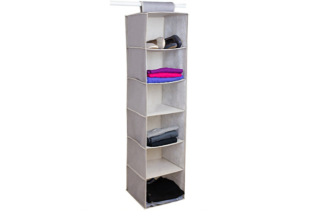 Taking full advantage of vertical space, this hanging organizer is a perfect addition to a small closet. Use each shelf to categorize your everyday essentials or coordinate different outfits. Sturdy cardboard inserts across the bottom of each cubby help to even the load, further maintaining its shape and structure. The breathable, non-woven fabric is gentle on clothes and fragile items, while the jute-like design brings a touch of luxury. The organizer is slim in size and collapses into a flat square to conserve space while storing.Made of non-woven fabric and cardboard | Beige, cream and brown | 6 shelves | Flexible fabric shelving for any space | Open cubby-style shelves for easy access to items | Folds flat for space-saving storage
