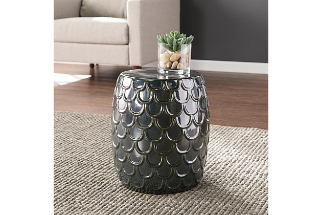 Add shimmer and shine to your space with this ceramic side table. A textured fish scale pattern glistens across the composition, evoking mermaid vibes in your living space.Made of ceramic | Metallic blue finish | No assembly required