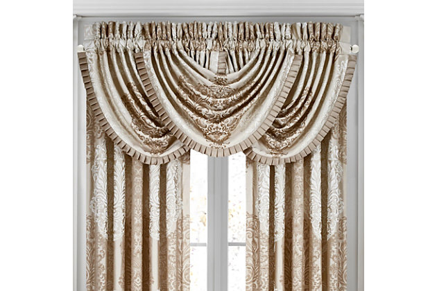 Evoking a mood of bygone elegance, the J. Queen New York La Scala Window Waterfall Valance brings the past beautifully into the present. Sure to add a decorator touch to your home, this damask patterned window valance with waterfall draping is crafted with care and finished with pleated solid satin.Made of polyester | Pocket rod design (3" header and 3" rod pocket) | Finished with a pleated solid satin | Matching curtains available, sold separately | Dry clean only | Imported