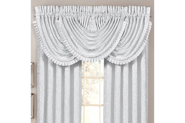 Evoking a mood of bygone elegance, the J. Queen New York Astoria - White Window Waterfall Valance brings the past beautifully into the present. Sure to add a decorator touch to your home, this damask patterned window valance with waterfall draping is crafted with care for the upscale aesthetic you desire.Made of polyester | Matching curtain panels available, sold separately | Dry clean only | Imported