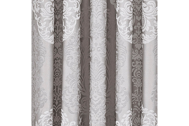 Evoking a mood of bygone elegance, the J. Queen New York La Scala - Silver 84" Window Panel Pair brings the past beautifully into the present. Sure to add a decorator touch to your home, this set of damask patterned window panels is crafted with care, always cut from the same starting point to ensure panels match when hung side by side. Made with 3" headers and 3" rod pockets, these panels include an opaque white lining for privacy.Sold as a pair (2 window panels) | Made of polyester | Pocket rod design (3" headers and 3" rod pockets) | Opaque white lining | Dry clean only | Imported | Matching valance available, sold separately