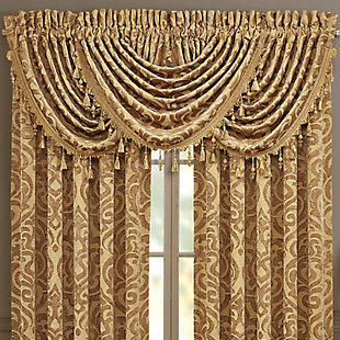 Evoking a mood of bygone elegance, the J. Queen New York Sicily - Gold Window Waterfall Valance brings the past beautifully into the present. Sure to add a decorator touch to your home, this damask patterned window valance with waterfall draping and tassel fringe is crafted with care for the upscale aesthetic you desire.Made of polyester | Tassel fringe | Matching curtain panels available, sold separately | Dry clean only | Imported