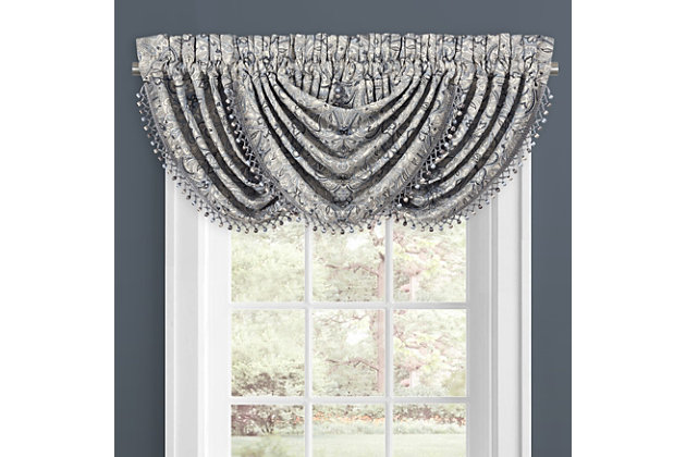 Evoking a mood of bygone elegance, the J. Queen New York Alexis Window Waterfall Valance brings the past beautifully into the present. Sure to add a decorator touch to your home, this damask patterned window valance with waterfall draping is crafted with care and made with 3" header and 3" rod pocket.Made of polyester | Pocket rod design (3" header and 3" rod pocket) | Satin finish | Matching curtain panels available, sold separately | Dry clean only | Imported