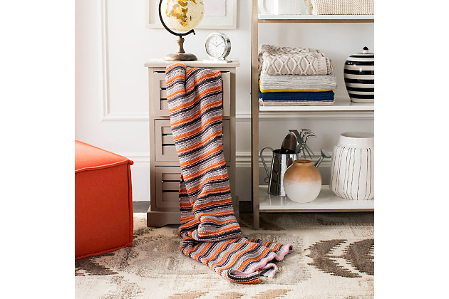 Soft and bright with a classic linear pattern, this all-cotton knit throw is a playful addition to your room decor. Its gray, orange and pink hues are accentuated with detailed stitching for rich texture. Drape across an accent chair or sofa for a subtle touch of spirited color.Made of cotton | Imported | Dry clean only