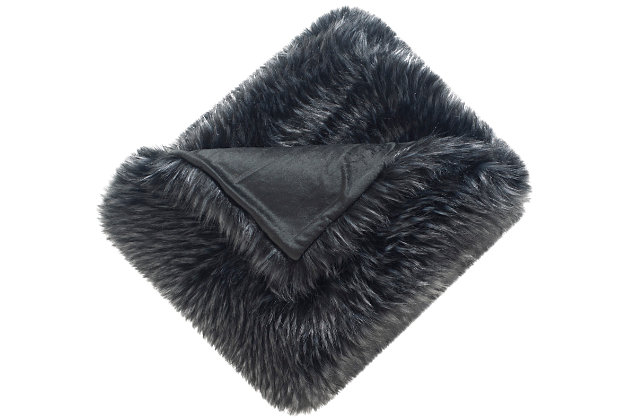 This is one grizzly that you definitely want in your living room or bedroom. This throw is the perfect accessory to add a soft, warm feel to leather sofas or clean-lined contemporary furnishings. Midnight black is enriched with subtly hinted lighter tones for an exotic, yet elegant, faux fur throw.Front made of acrylic; back made of poly suede | Imported | Machine washable