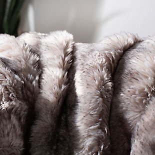 Give in to your animal instinct with this soft, seductive faux fur throw. The subtle splash of alluring color will add an exotic touch to your room decor. Not to mention, you’ll go wild for its luxurious textural feel.Front made of acrylic; back made of poly suede | Imported | Machine washable