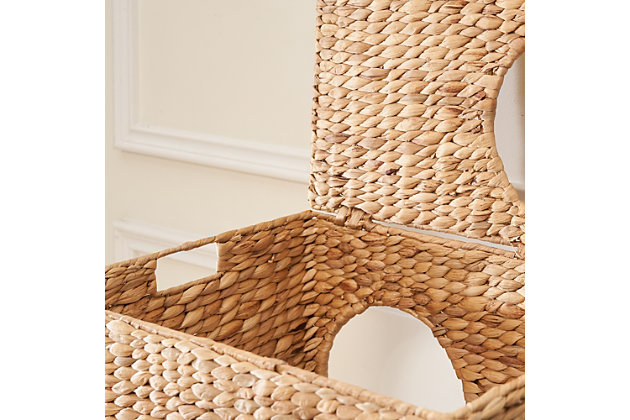 This handwoven water hyacinth cat house with cushions is not only perfect for your cat but is also a piece of rustic decor for your home. Woven from eco-friendly natural water hyacinth with thick braids and a fishbone weave, and supported by a rustproof iron frame, it's strong and durable. Five holes and two stories with soft and comfortable cushions offer the most wonderful place for your cat to play and enjoy. This cat house is also lightweight, so it can be easily moved from room to room. Its natural golden and toffee-colored finish brings a soothing, natural feel to your home.Made of natural water hyacinth and iron | Natural finish | Rustproof frame | 5 holes | Includes 2 cushions | Eco-friendly | Weight capacity 30 pounds | No assembly required