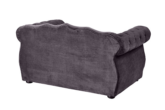 Pamper your pet and add a touch of style to any room with this pet bed that's easy on the eyes. Your four-legged family member can sleep comfortably any time of day without being separated from family activity. The luxurious pet sofa features a button-tufted back and hand-applied nailhead trim. Its washable, waterproof velvet is easy to clean and sure to last.Wood frame | Upholstered in waterproof velvet fabric | Handmade | Removable, washable cushion | No assembly required | Imported