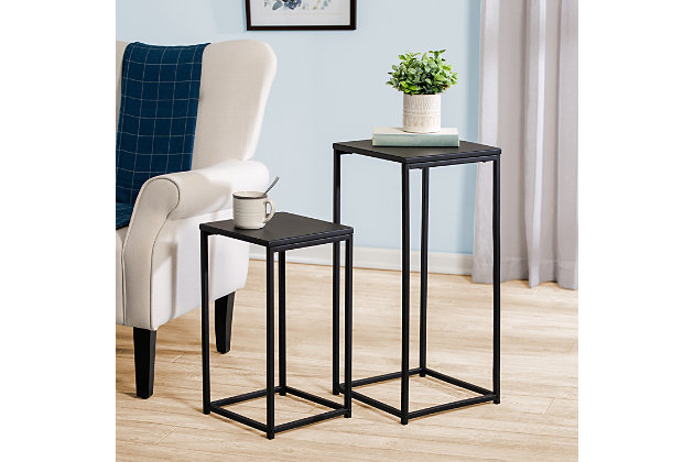 This set of 2 black side tables brings a mixture of style and substance to your space. One large table (13"L x 13"W x 29"H) and one small (12"L x 12"W x 21"H) can stand on their own or double up the end tables to act as a design statement. Nest the smaller one under the larger one for easy storage when not in use.One large and one smaller square table | Smaller table nests neatly under larger one for easy storage | Clean lines create ideal living room accents to any furniture decor | Made of all steel with a metal top