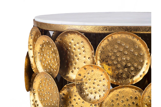 The Brie side table is a true work of art. Its marble top perched upon a base of dozens of hand hammered discs make this unique table a stunning enhancement to any room. As this is a handmade product, slight variations are to be expected and may result in small gaps between the marble and frame.Completely handmade by master artisans | Hand hammered table with marble top | No assembly required | Crafted in India