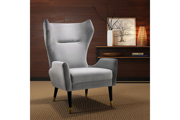 Mid-century design gets a fab remake with the sculptural Logan chair from TŌV Furniture. The dark brown Beech conical shaped legs boast gold tipping, while the elegantly curved silhouette provides maximum comfort and the wood frame provides strong support. Logan is the statement chair you've been searching for. Available in textured navy or gray velvet.Fabulous Mid-Century design | Elegantly curved silhouette provides maximum comfort | Dark brown Beech conical shaped legs with gold tippings | Kiln dried wood frame | Kiln dried wood frame