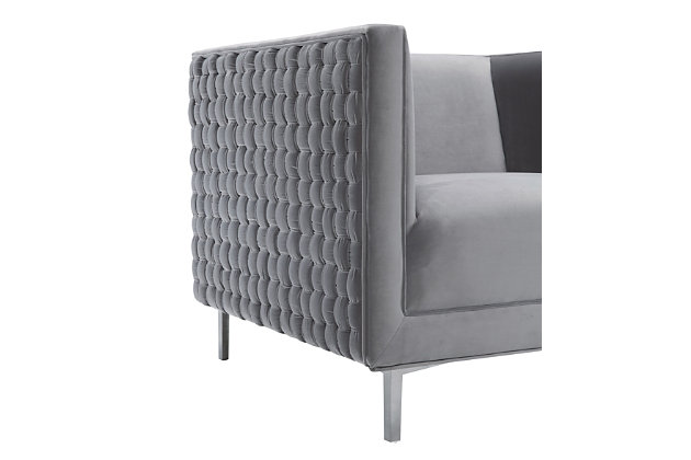 The magnificent Sal chair from TŌV Furniture features an intricate hand woven pattern of plush velvet perched upon glamorous silver legs. Available in multiple sumptuous velvet color options.Handmade by skilled furniture craftsmen | Available in sumptuous sea blue or gray velvet | Shapely stainless steel legs | Minor assembly required