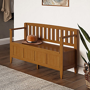 The Brooklyn Entryway Bench hand-crafted using solid wood so that you can make a statement in your front hallway. This stylish bench allows your inner interior designer shine through while creating added storage and seating for your entryway or mudroom. "Form follows function" design rules apply here as the bench features a convenient flip up lid allowing for easy retrieval of articles from the dual storage compartment below.; Efforts are made to reproduce accurate colors, variations in color may occur due to computer monitor and photography; At Simpli Home we believe in creating excellent, high quality products made from the finest materials at an affordable price. Every one of our products come with a 1-year warranty and easy returns if you are not satisfiedDIMENSIONS: 17" D x 48" W x 28" H; Handcrafted with care using the finest quality solid wood | Hand-finished with a Light Golden Brown stain and a protective NC lacquer to accentuate and highlight the grain and the uniqueness of each piece of furniture. | Large, spacious entryway bench seats 2 comfortably; Assembly Required | Lift up bench lid opens using safety hinges to expose 2 large internal storage compartments; Contemporary Style includes shaker square front panels, vertical slat back and slightly tapered legs