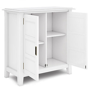 You like to be neat and tidy...that's good, so do we. We designed the Burlington Low Storage Cabinet to organize and enhance the design of your home. Two enclosed adjustable shelves offer the versatility to effortlessly organize and stow away anything you wish. Whether you use it to display your favorite knick knacks or tuck away all those toys, boxes, and extra linens the Burlington Low Storage Cabinet allows you to hide away the clutter behind beautifully designed wood doors. This beautiful and functional piece can be used in any room in your home.; Efforts are made to reproduce accurate colors, variations in color may occur due to computer monitor and photography; At Simpli Home we believe in creating excellent, high quality products made from the finest materials at an affordable price. Every one of our products come with a 1-year warranty and easy returns if you are not satisfiedDIMENSIONS: 14" D x 30" W x 31" H | Handcrafted with care using the finest quality solid wood | Hand-finished in White with a protective NC lacquer | Multipurpose cabinet offers plenty of functional storage. Looks great in your living room, entryway, bedroom ,dining room, condo or office | Features 2 panel doors that open to 2 adjustable shelves for versatile storage | Transitional design includes dupont edge top, slightly tapered legs, framed panel doors with brushed nickel classic pulls | Assembly Required | We believe in creating excellent, high quality products made from the finest materials at an affordable price. Every one of our products come with a 1-year warranty and easy returns if you are not satisfied.