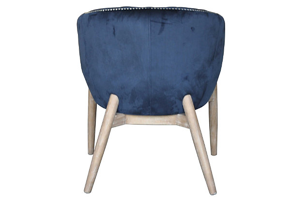 Add style and luxury to your space with this elegant plush velvet chair. Silver nailhead trim and vertical channeling add the perfect finishing details. Constructed with solid wood tapered legs for a modern look and sturdy design.Velvet | Wood Legs | Available in 3 colors | Nail head trim