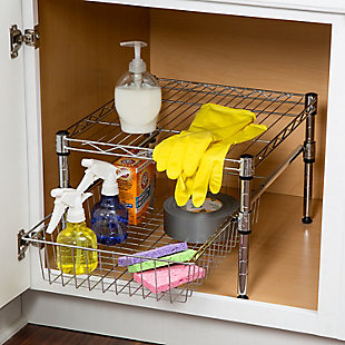 A flexible storage solution that adjusts in height to accommodate tall or shorter items in most cabinets. Also good for pantry organization, the contemporary design and brilliant chrome finish present a polished look when you open your cabinets. Handy and sizable, the wire basket pulls out for easy access to anything from food items to under-the-sink cleaning supplies. This shelf works best in cabinets that are 18 inches wide or larger.A flexible storage solution that adjusts in height to accommodate tall or shorter items in most cabinets. Also good for pantry organization, the contemporary design and brilliant chrome finish present a polished look when you open your cabinets. Handy and sizable, the wire basket pulls out for easy access to anything from food items to under-the-sink cleaning supplies. This shelf works best in cabinets that are 18 inches wide or larger. | Basket provides catch-all for smaller items | Sturdy construction for durability | Dimensions: 15”l x 17.5”w x 10.5”h