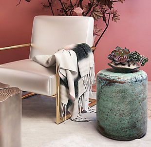 Create a stylish yet cozy new look with the Afrino throw. Luxuriously soft, it features muted colors and tasseled sides. Drape it over your shoulders for added warmth, or on your favorite furniture for a touch of color in any space.Made of acrylic/polyester/wool | Soft texture | Tassel details | Imported