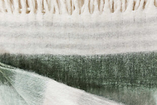 Give your favorite spot in your home an inviting look with the luxuriously soft Afrino throw. Subtle greens and soft grays are easy on the eyes. Wrap this striking tasseled throw around your shoulders for extra warmth, or add it to your favorite furniture to create a stylish and inviting new look.Made of acrylic/polyester/wool | Soft texture | Tassel details | Imported
