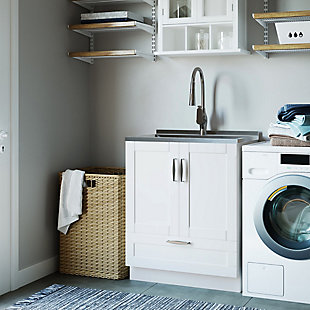The Reed 28 inch Laundry Cabinet is the ultimate solution to all your laundry room storage needs. With its two Shaker-style doors and bottom drawer, the Reed helps you keep organized. The laundry cabinet includes a single lever high-arc faucet and deep welded stainless steel sink. Efforts are made to reproduce accurate colors, variations in color may occur due to computer monitor and  photography. At Simpli Home we believe in creating excellent, high quality products made from the finest materials at an affordable price.Pure White, Constructed using PB, MDF and Stainless Steel; Extra deep 20 gauge welded stainless steel sink | High arch single lever faucet with on and off spray | Plumbing parts included; Dimensions: 27.6" W 34.3" H x 18.9" D | Two (2) doors and one (1) bottom drawer open to plenty of storage; Brushed Nickel hardware