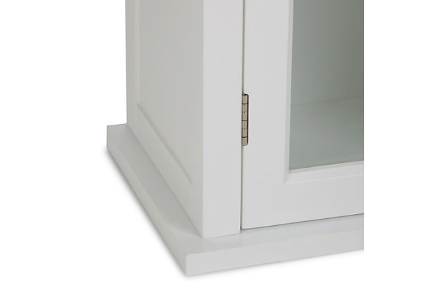 You need a little more storage than what your medicine cabinet has to offer. Consider this compact wall cabinet with an adjustable shelf. It offers you extra room for cosmetics, medicines, and other bath items. Efforts are made to reproduce accurate colors, variations in color may occur due to computer monitor and  photography. At Simpli Home we believe in creating excellent, high quality products made from the finest materials at an affordable price.Constructed using high quality MDF, Rubberwood and Tempered Glass; Durable Pure White painted finish sealed with a premium NC lacquer coating | One (1) door with one (1) adjustable interior shelf. Contemporary Brushed Nickel handles | Shaker styled front and side panels with molded top detail, Rubber wood frame; Dimensions: 15"w x 10" d x 27" H | Adjustable interior shelf; Contemporary styling