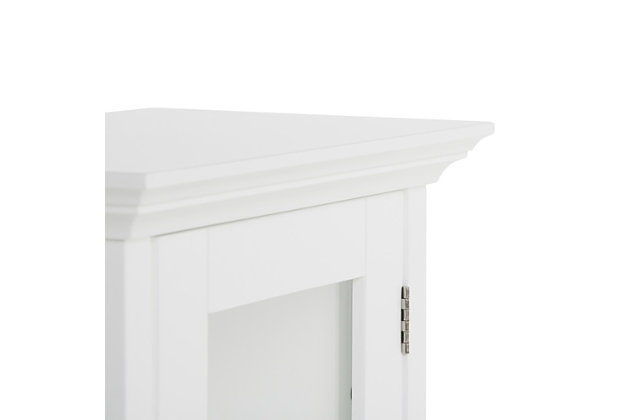 Save space and add storage to the room with the Acadian Single Door Wall Cabinet. This cabinet fits perfectly in a small space to add additional storage, and it features two shelves for plenty of storage to keep your room free of clutter. Great in a small bathroom or powder room. Efforts are made to reproduce accurate colors, variations in color may occur due to computer monitor and  photography. At Simpli Home we believe in creating excellent, high quality products made from the finest materials at an affordable price.DIMENSIONS: 15.75"w x 10.04" d x 27.96" H | Constructed using Rubberwood, Engineered Wood and Tempered Glass | Durable Pure White painted finish sealed with a premium NC lacquer coating | Features single (1) Door with one (1) adjustable interior shelf and one (1) open bottom shelf. Brushed nickel hardware | Grooved detail on side panels, Solid Rubber wood frame | Contemporary styling, Mounting hardware included | Assembly required | We believe in creating excellent, high quality products made from the finest materials at an affordable price. Every one of our products come with a 1-year warranty and easy returns if you are not satisfied.