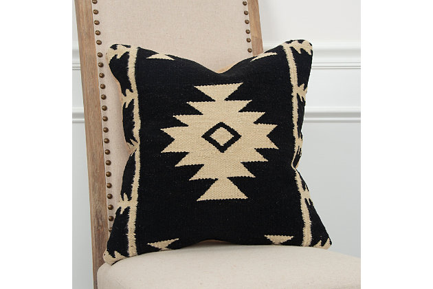 This pillow uses vintage southwestern motif patterning in a flat woven rug construction to bring that vintage handcrafted appeal. A solid coordinating back features a zippered closure for ease of fill and cleaning.100% wool | Decorative pillow with removable cover for easy cleaning | Dry cleaning recommended for removable cover | Unique accent piece | Durable for lifestyle use | Black | Polyfill | Imported