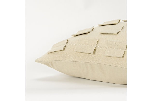 This pillow is part of the Donny Osmond Home Collection. This delightfully soft felted face is accented with dimensional self-felted shapes that are off-set in rows to show as a stripe. These shapes are then secured by a running rice embroidery stitch so the embroidery doubly accentuates the striped patterning. This pillow is a wonderful study in a single color textural design with dramatic lift and impact. The back of this knife edged pillow is a soft coordinating solid cotton and features a hidden zipper closure for ease of fill. This pillow is reminiscent of the beautifully crafted suits of the 1960’s and the fashion icons of that era, beautifully recaptured for today’s home fashion.Wool | Felted face | Felted tabs inset into seam | Dimensional felt accents | Dry clean only | Brown | Polyfill | Imported