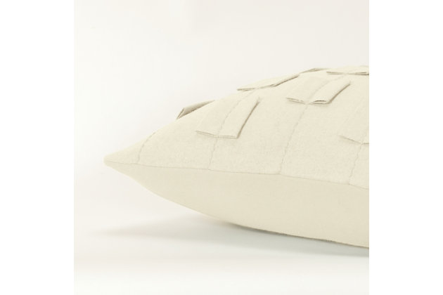 This pillow is part of the Donny Osmond Home Collection. This delightfully soft felted face is accented with dimensional self-felted shapes that are off-set in rows to show as a stripe. These shapes are then secured by a running rice embroidery stitch so the embroidery doubly accentuates the striped patterning. This pillow is a wonderful study in a single color textural design with dramatic lift and impact. The back of this knife edged pillow is a soft coordinating solid cotton and features a hidden zipper closure for ease of fill. This pillow is reminiscent of the beautifully crafted suits of the 1960’s and the fashion icons of that era, beautifully recaptured for today’s home fashion.Wool | Felted face | Felted tabs inset into seam | Dimensional felt accents | Dry clean only | White | Polyfill | Imported