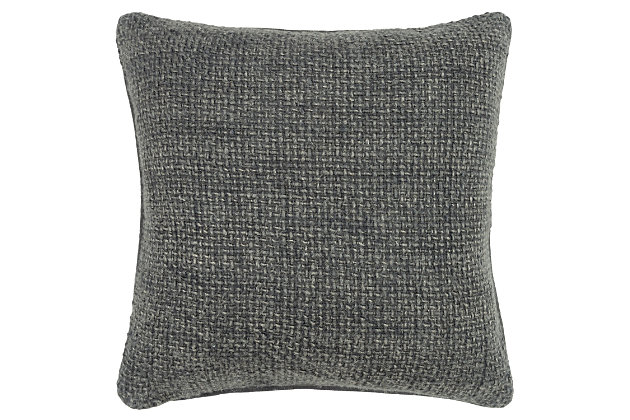 This pillow is part of the Donny Osmond Home Collection. Texture, soft texture, beautifully appointed texture, sophisticated texture!  How many ways can we describe this beautifully skin-friendly blending of linen and soft, soft, soft cotton yarning to create a divinely textured pillow that is classic in its appeal and timeless in its divinity. This pillow features a solid coordinating cotton canvas back. Please note that given the chunky nature of these soft yarns, should the end of one “sprout”, it should NOT be considered a flaw. It will simply be where one yarn stopped and another began in the weaving process. Simply clip closely with a scissor and it will be restored promptly to perfection. The simplicity of the weave with the best of natural fibers give this pillow an organic artistry unsurpassed.Linen | Solid woven linen | Soft textural weave | Solid coordinating back | Dry clean only | Gray | Polyfill | Imported
