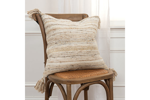 Knife edged, this pillow features woven patterning that works as a solid in your indoor or covered outdoor living space. Four corner tassels add charm and whimsey to this contemporary styling. Shades of neutrals allow this pillow to work beautifully with many sling or woven patterned outdoor or indoor upholstered sofa groups. This pillow features a hidden back zipper closure for ease of fill. Suitable for outdoor use.Polyester | Indoor or covered outdoor use | Water resistant | Solid coordinating back | Machine wash cold, gentle cycle,  tumble dry low, do not bleach | Brown | Polyfill | Imported