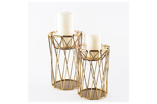 The Othello candle holders are beautifully styled antiqued brass candle holders that look good on their own or with a mate. (Candles not included). Measuring 6.5" long by 6.5" wide by 10.0" high.The Othello candle holder, measuring 6.5" long by 6.5" wide by 10.0" high, is a stylish piece that is sure to beautifully illuminate your space. | The Othello, skillfully crafted from metal to hold one candle, is a beautiful and unique addition to your space that is sure to stand the test of time. | The Othello is finished in a  spectacular antiqued-brass tone, making it a stunning candle holder that is sure to turn heads. | Featuring a stunning design that flaunts clean lines and subtle curves, this candle holder makes for a gorgeous addition to spaces based on the modern or design style.