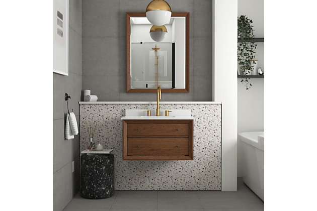 The mid-century modern-inspired Agnes floating bathroom vanity with sink is perfect for your master bathroom, guest bathroom or powder room. It features optional metal hairpin legs, wood drawers, a composite granite countertop/backsplash and a ceramic rectangular sink.Includes vanity and sink | Composite granite top and backsplash; vanity floating must be mounted to the wall with optional metal hairpin legs | Ceramic, rectangular integrated sink | Crafted with pine, engineered wood and engineered veneer | Includes 1 wood storage drawer and 1 faux drawer | Semi-matte black hardware | Resilient countertop is non-porous, antibacterial and easy to clean and maintain | Lacquer coating for extra durability | Back panel cutout for easy access to plumbing | Pre-drilled holes for 8" center set faucet installation | Faucet and drain sold separately | Assembly required