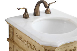 The superb balance of timeless tradition and opulent beauty is expressed in this vanity set. The beautifully carved floral design will certainly enhance the aesthetics of any home or office bathroom. Truly a statement of luxury, this vanity features a marble countertop that complements the hand-painted cabinet, an oval-shaped porcelain sink, stylishly carved solid wood French scroll feet and an antiqued bronze-tone doorknob.Hand-painted finish | Marble countertop | Solid wood and engineered wood base | Metal doorknob with antiqued bronze-tone finish | Single porcelain undermount sink | Single-door cabinet with 1 shelf | Metal hardware with antiqued finish | Pre-drilled faucet holes; faucet not included | No assembly required