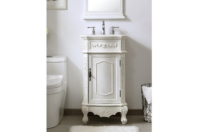 The superb balance of timeless tradition and opulent beauty is expressed in this vanity set. The beautiy carved floral design will certainly enhance the aesthetics of any home or office bathroom. Truly a statement of luxury, this vanity features a marble countertop that complements the hand-painted cabinet, an oval-shaped porcelain sink, stylishly carved solid wood French scroll feet and an antiqued bronze-tone doorknob.Hand-painted finish | Marble countertop | Solid wood and engineered wood base | Metal doorknob with antiqued bronze-tone finish | Single porcelain undermount sink | Single-door cabinet with 1 shelf | Metal hardware with antiqued finish | Pre-drilled faucet holes; faucet not included | No assembly required