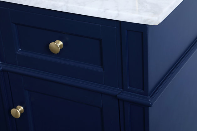 From its Italian Carrara white marble top to its contemporary-styled, hand-painted urban blue finished cabinet, this vanity is sure to enhance your home or office bathroom. Beneath its lustrous, natural stone marble top is an oval porcelain sink and single-door cabinet with a single shelf for storing all your bathroom essentials. Goldtone steel knobs, soft-closing doors and elegantly tapered legs add wonderful balance to the beautiful form and practical function.Made of solid wood, engineered wood, marble and porcelain | White carrara marble countertop | Single porcelain undermount sink | Steel hardware with goldtone finish | Soft-close cabinet door | Single shelf | Faux drawer | Pre-drilled faucet holes; faucet not included | Cutout back panel for plumbing installation | No assembly required