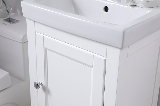 Optimize your bathroom with style, efficiency and functionality with this "chic and unique" single bathroom vanity crafted of solid poplar wood. Its contemporary-style cabinet base, painted in a white finish and accented with gleaming chrome-tone knobs, features a single door and a drawer with undermount soft-close glides, providing extra storage spaces for your bathroom essentials. Rounding out the design is a white resin countertop with integrated sink and pre-drilled faucet hole.Made of poplar wood and resin | resin countertop with integrated resin sink | Hardware with chrome-tone finish | Single door and single drawer with undermount soft-close glides | Pre-drilled faucet hole; faucet not included | Cutout back panel for plumbing installation | No assembly required