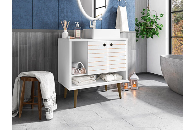 Refresh your bathroom or powder room space with the Liberty vanity. This vanity offers storage and style all at once. Beautiful splayed legs and detailed cabinet doors are seamless and versatile, easily blending with any interior design. Cabinet doors conceal shelving space to help arrange personal items, cleaning supplies and more, while a lower open shelf is great for tuc away extra toiletries, diffusers or candles. Open side storage stashes away extra supplies and displays towels, giving your bathroom that hotel feel.Freestanding vanity with sink for bathroom usage | White finish | Made with wood | Sink made with faux marble; vessel faucet installation type | Splayed legs made with solid wood for extra durability | Includes 2 open shelves for storage and 2 doors concealing water pipes | 90-degree open door style with soft-close features and ring cutout knobs with sleek lateral line indent design | Assembly required