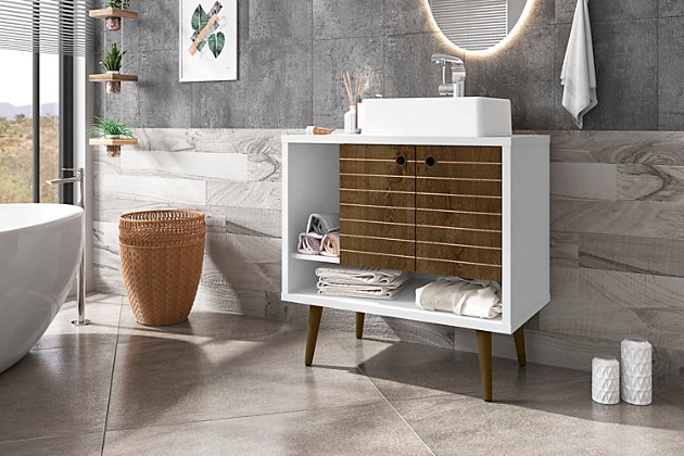 Refresh your bathroom or powder room space with the Liberty vanity. This vanity offers storage and style all at once. Beautiful splayed legs and detailed cabinet doors are seamless and versatile, easily blending with any interior design. Cabinet doors conceal shelving space to help arrange personal items, cleaning supplies and more, while a lower open shelf is great for tucking away extra toiletries, diffusers or candles. Open side storage stashes away extra supplies and displays towels, giving your bathroom that hotel feel.Freestanding vanity with sink for bathroom usage | White and rustic brown finish | Made with wood | Sink made with faux marble; vessel faucet installation type | Splayed legs made with solid wood for extra durability | Includes 2 open shelves for storage and 2 doors concealing water pipes | 90-degree open door style with soft-close features and ring cutout knobs with sleek lateral line indent design | Assembly required