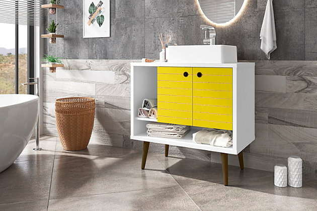 Refresh your bathroom or powder room space with the Liberty vanity. This vanity offers storage and style all at once. Beautiful splayed legs and detailed cabinet doors are seamless and versatile, easily blending with any interior design. Cabinet doors conceal shelving space to help arrange personal items, cleaning supplies and more, while a lower open shelf is great for tucking away extra toiletries, diffusers or candles. Open side storage stashes away extra supplies and displays towels, giving your bathroom that hotel feel.Freestanding vanity with sink for bathroom usage | White and yellow finish | Made with wood | Sink made with faux marble; vessel faucet installation type | Splayed legs made with solid wood for extra durability | Includes 2 open shelves for storage and 2 doors concealing water pipes | 90-degree open door style with soft-close features and ring cutout knobs with sleek lateral line indent design | Assembly required