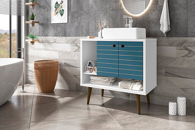 Refresh your bathroom or powder room space with the Liberty vanity. This vanity offers storage and style all at once. Beautiful splayed legs and detailed cabinet doors are seamless and versatile, easily blending with any interior design. Cabinet doors conceal shelving space to help arrange personal items, cleaning supplies and more, while a lower open shelf is great for tucking away extra toiletries, diffusers or candles. Open side storage stashes away extra supplies and displays towels, giving your bathroom that hotel feel.Freestanding vanity with sink for bathroom usage | White and aqua blue finish | Made with wood | Sink made with faux marble; vessel faucet installation type | Splayed legs made with solid wood for extra durability | Includes 2 open shelves for storage and 2 doors concealing water pipes | 90-degree open door style with soft-close features and ring cutout knobs with sleek lateral line indent design | Assembly required